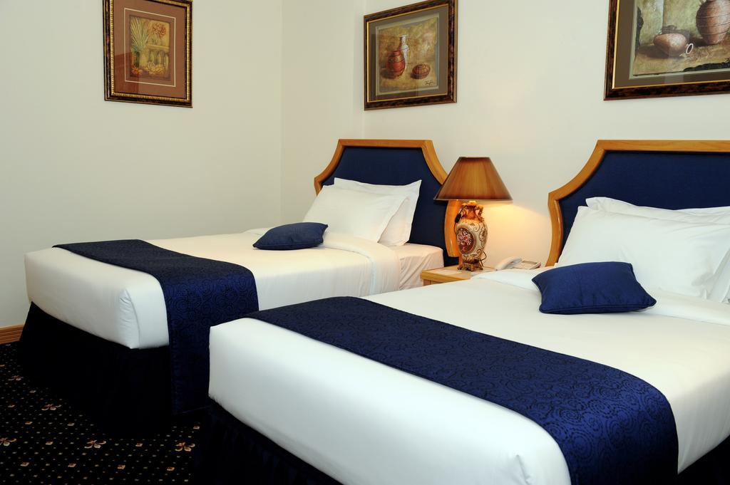 Cayam Hotel Doha Værelse billede